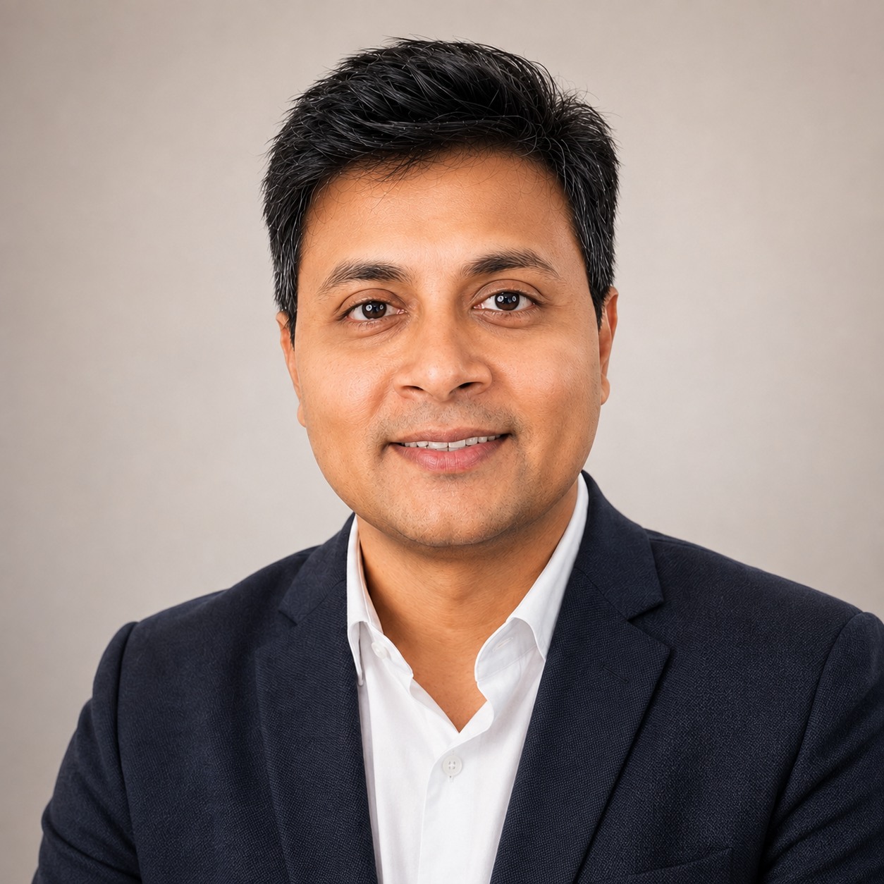 Portrait of Sayantan Nandi in a dark blazer and white shirt.